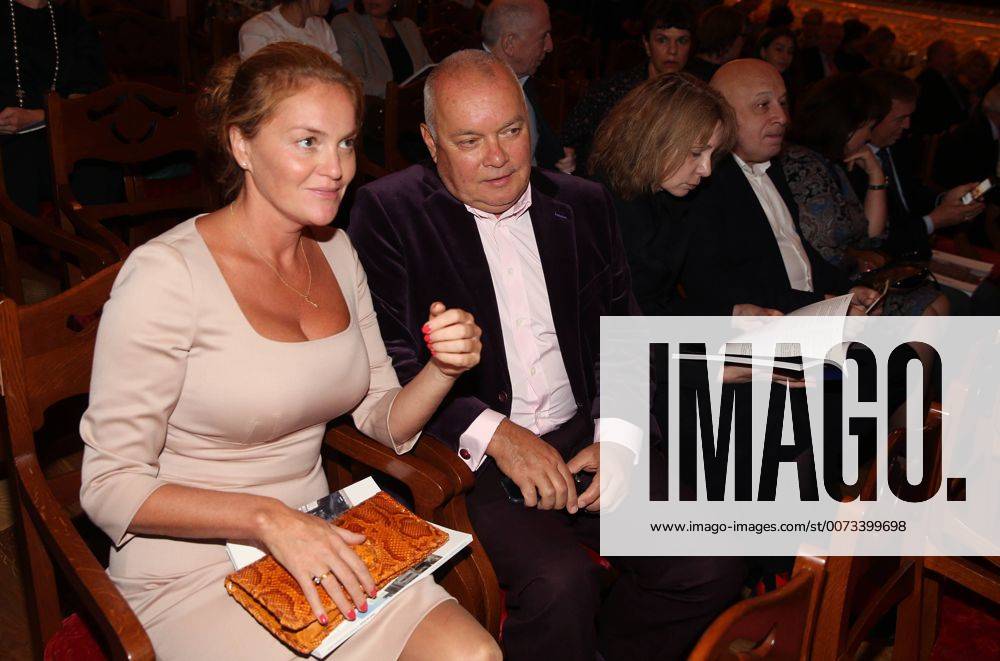 Journalist Dmitry Kiselev (C) with wife Maria at Moscow s Bolshoi Theatre where a production of Giuseppe Verdi s opera Simon Boccanegra is to be presented by the Teatro alla Scala (Milan s grand opera house) as part of the 2016 Chereshnevy Les Open Art Festival. Artyom Korotayev TASS TS03116E