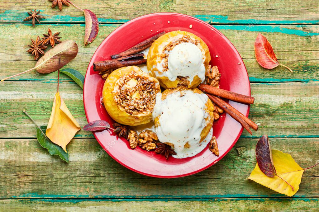 Baked apples stuffed with granola and nuts.Baking concept