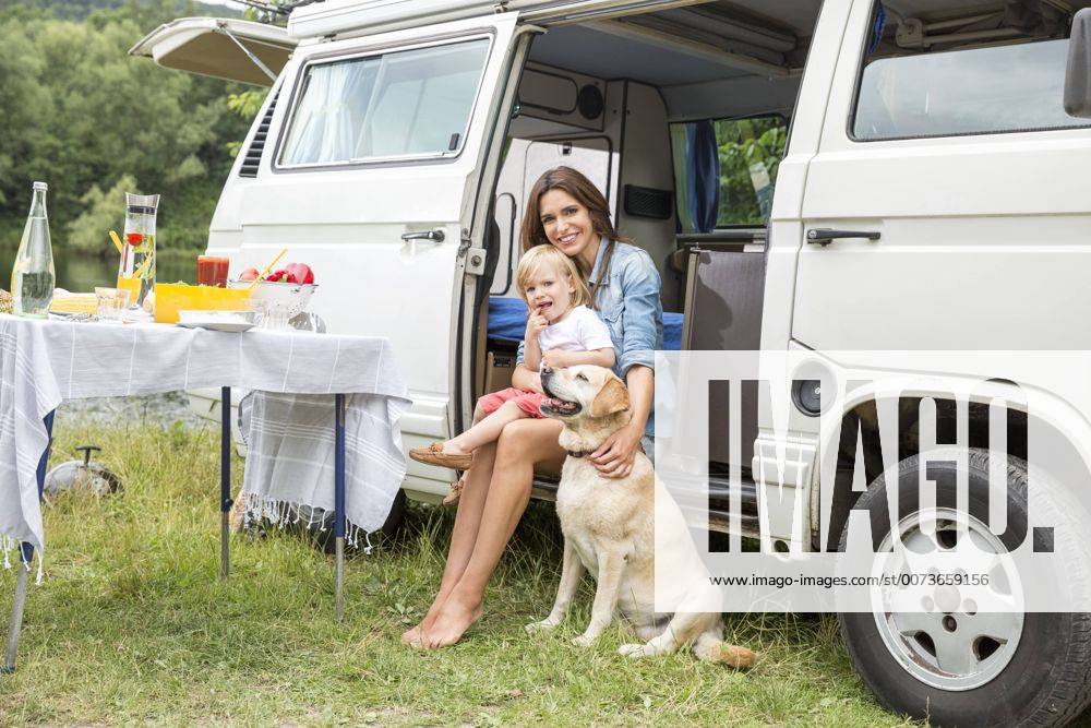 Mother and son with dog at van in the nature model released Symbolfoto property released FMKF002786