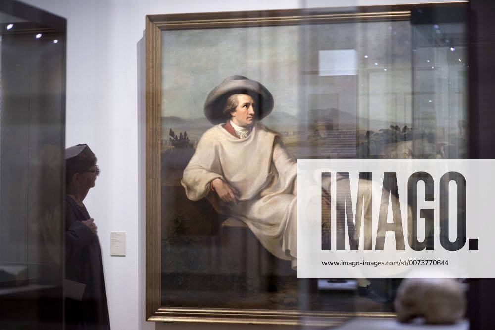 The British View Germany - Memories of a Nation, Exhibition Gropius-Bau DEU, Deutschland, Germany, Berlin, 07.10.2016 Besucher betrachtet ein Werk mit Motiv Johann Wolfgang von Goethe, Goethe in der Campagna von Karl Bennert, in der Ausstellung Der Britische Blick Deutschland - Erinnerungen einer Nation, The British View German - Memories of a Nation, im Martin-Gropius-Bau in Berlin. Die Ausstellung eroeffnet am 08. Oktober und geht bis 09. Januar und praesentiert ca 200 Objekte welche einen Bezug zu den letzten 600 Jahre Geschichte in Deutschland haben. Sie zeigt Spuren deutscher Identitaet aus britischer Perspektive. Visitor next to a painting of Johann Wolfgang von Goethe, Goethe in the Campagna by Karl Bennert, on display during his exhibition Der Britische Blick Deutschland - Erinnerungen einer Nation, The British View German - Memories of a Nation, at the Martin Gropius Bau in Berl