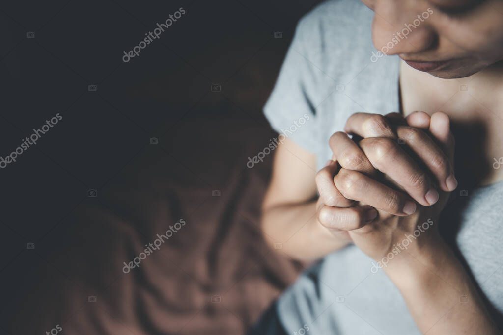 Female hands praying for God's blessing to wish for a better life. Believe in goodness, shake hands in prayer. Love, mercy, help from God. Praise the religion. Supreme Faith in the God of Success.