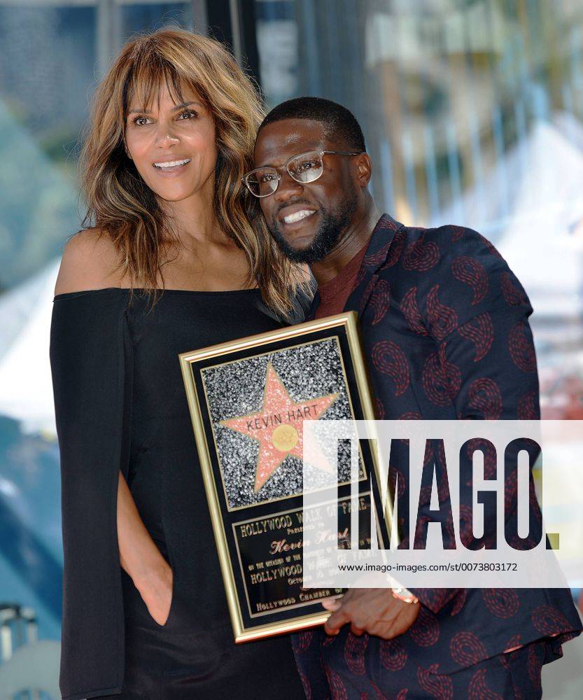 Actor Kevin Hart (R) and Halle Berry attend Hart s star unveiling ceremony on the Hollywood Walk of Fame in Los Angeles , California on October 10, 2016. LAP20161010706 CHRISTINExCHEW