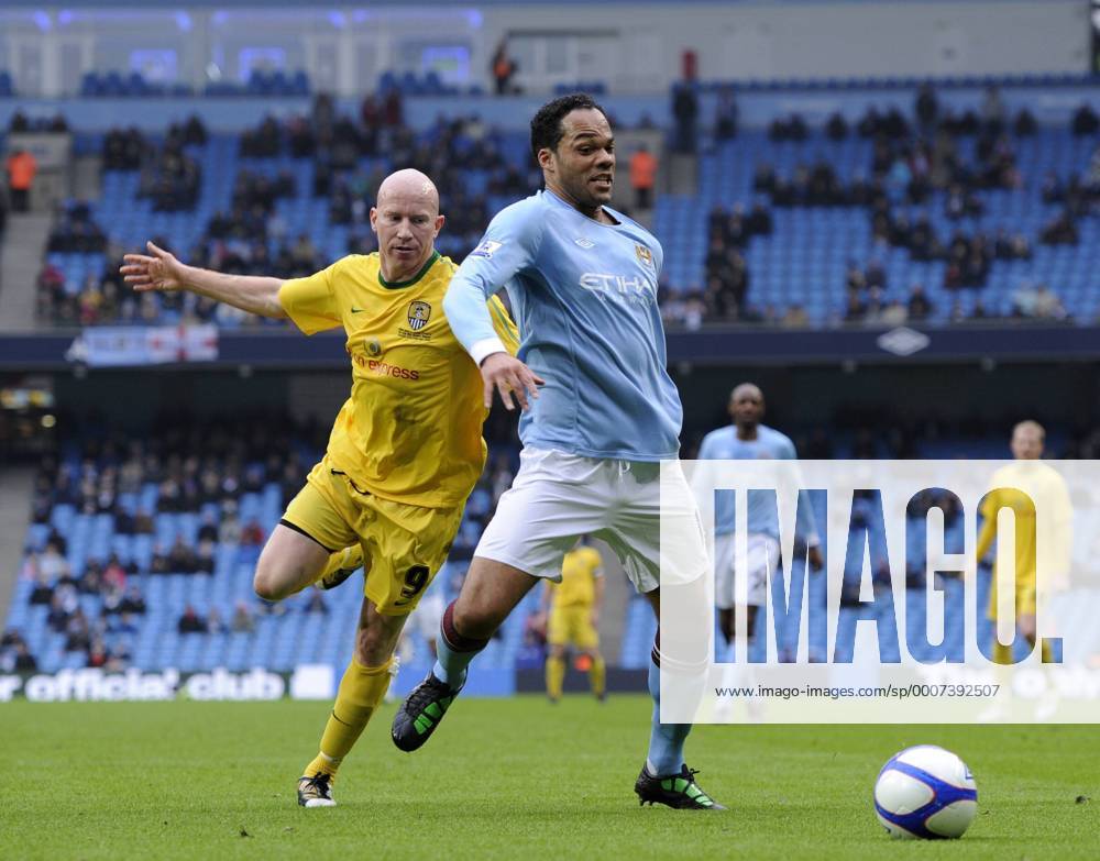 Joleen Lescott of Manchester City (R) and Lee Hughes of Notts County EON FA Cup 4th Round replay Manchester City v Notts County 20th February, 2011 .