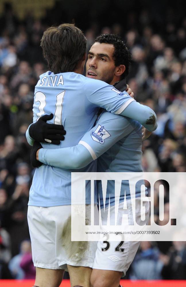Carlos Tevez of Manchester City (R) celebrates scoring third goal - FA Cup 4th Round replay Manchester City - Notts County - .