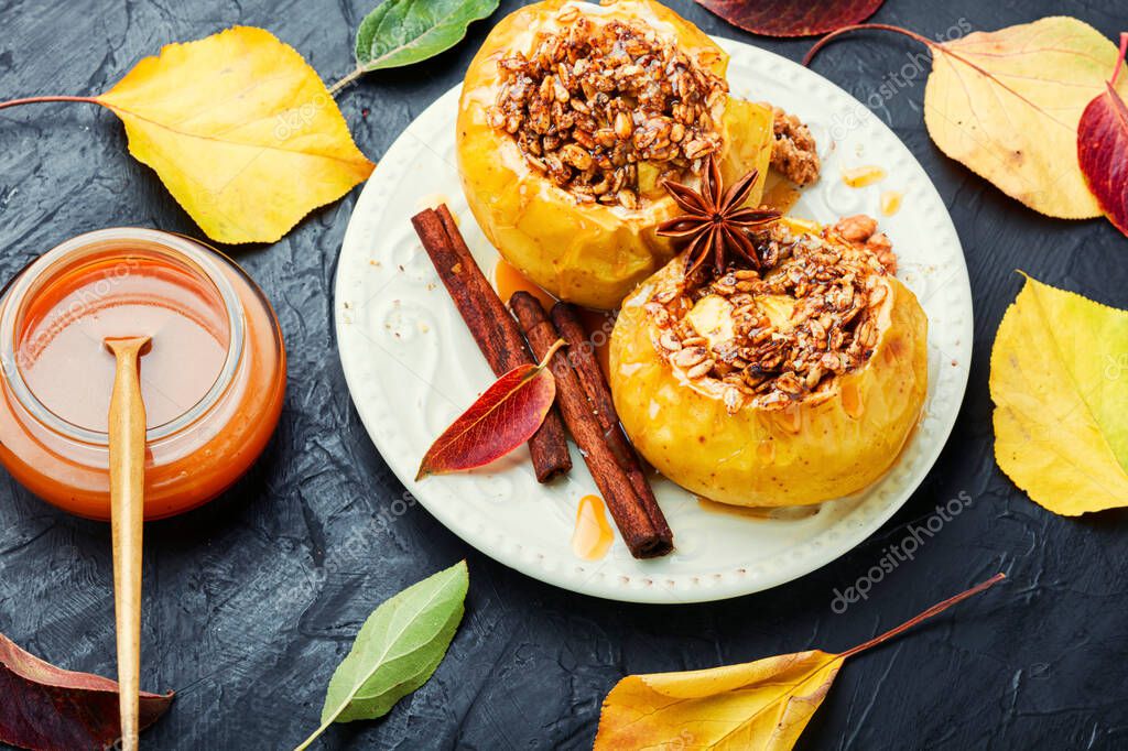 Baked apples stuffed with granola and nuts.Baking concept