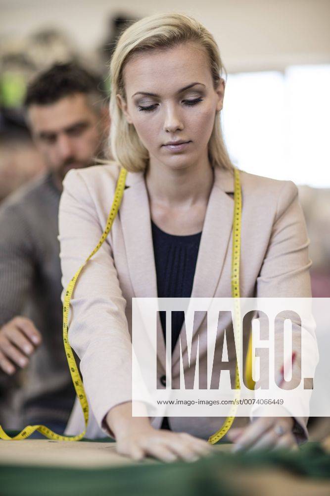 Fashion designer working in workshop model released Symbolfoto property released ZEF10665