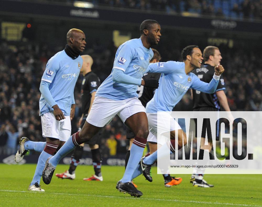Football - FA Cup Fifth Round - Manchester City vs. Aston Villa -- Yaya Toure of Manchester City celeebrates his opening goal with team mates Mario Balotelli (L) and Jolean Lescott (R) at the City of Manchester Stadium .