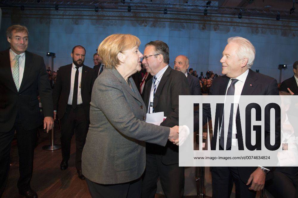 Berlin, Germany - German Chancellor Angela Merkel (L) shake hands with CEO of Deutsche Bahn Ruediger Grube (R) before a a BDA (Bundesvereinigung der Deutschen Arbeitgeberverbaende - Federal Union of the German Employers Associations) meeting in Berlin, Germany on November 15, 2016. Berlin Germany - ZUMAn230 20161115_zaa_n230_369