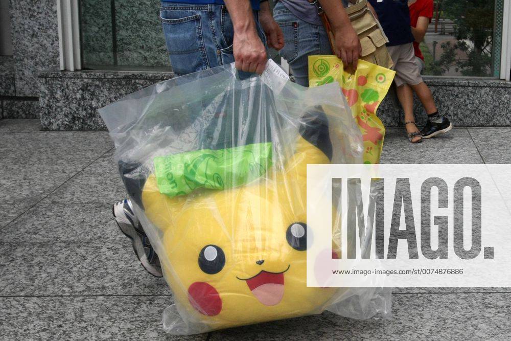 Aug. 01, 2009 - Tokyo, Japan - Pokemon center of Tokyo is big attraction for Japanese children on summer vacation. Fathers put on a hat of popular character Pikachu, Children run around with giant Pokemons grace the walls. For fans of the beloved Pok mon Mystery Dungeon video game series, this fall promises to be an especially thrilling one. - ZUMAy06_ 20090801_jab_y06_928