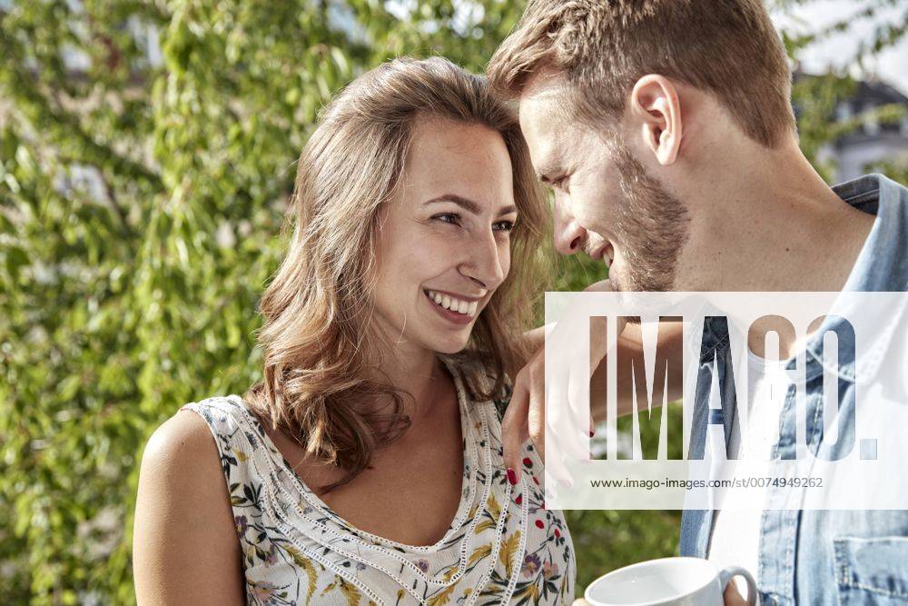 Happy couple in love on balcony model released Symbolfoto property released FMKF03148