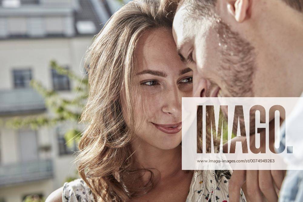 Happy couple in love on balcony model released Symbolfoto property released FMKF03149
