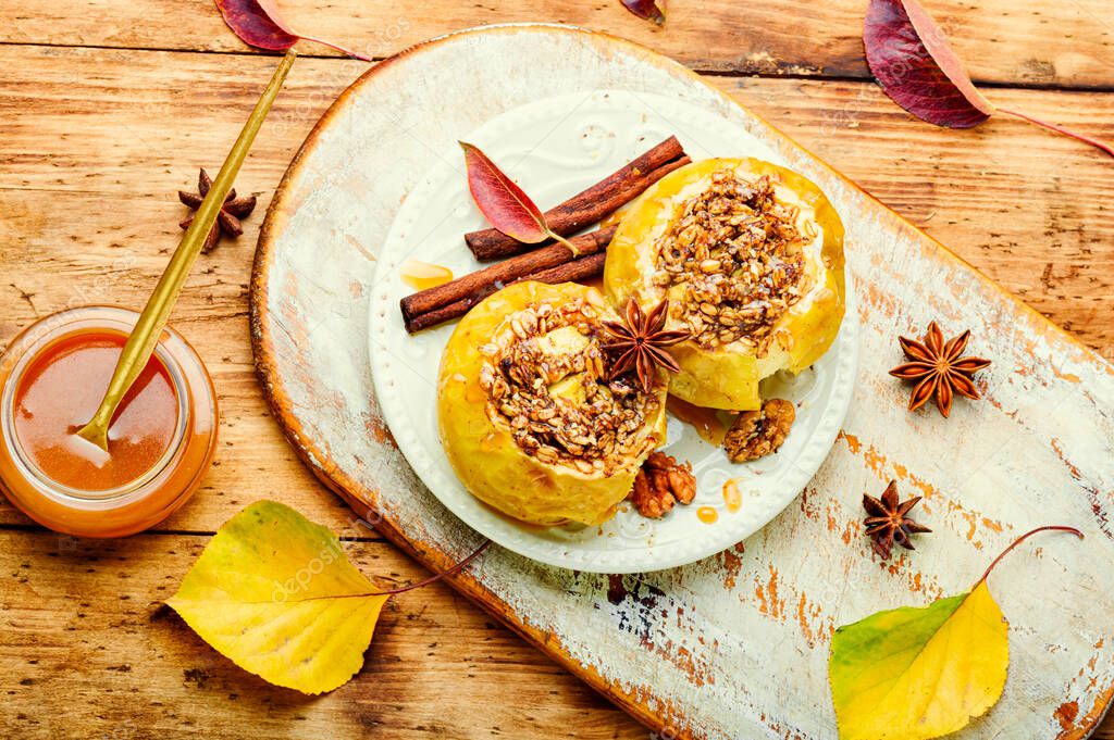 Baked apples stuffed with granola and nuts.Baking concept