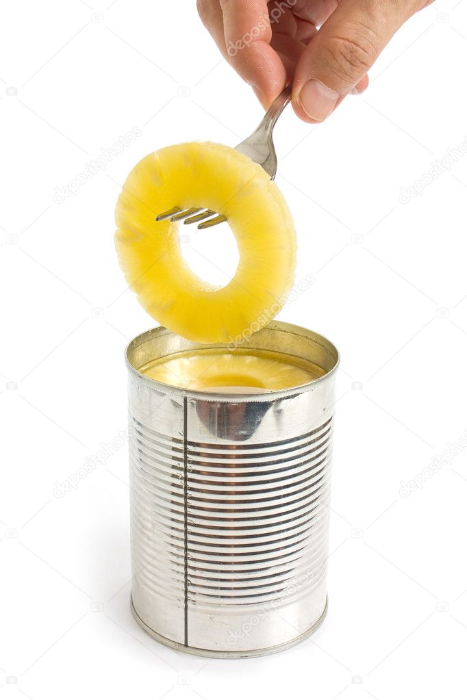 Pineapple ring on a fork isolated on white background