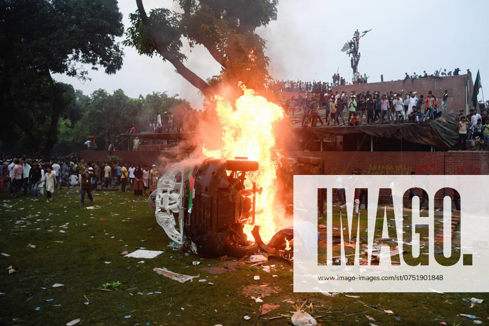 A car seen on fire inside the Ganobhaban during the celebration at the country s Prime Minister Sheikh Hasina s residence after she fled and resigned. Thousands of People celebrate the resignation of Bangladeshi Prime Minister Sheikh Hasina. Protests in Bangladesh that began as student-led demonstrations against government hiring rules in July culminated on August 5, in the Prime Minister fleeing and the military announcing it would form an interim government. Dhaka Bangladesh - ZUMAs197 20240805_aaa_s197_096