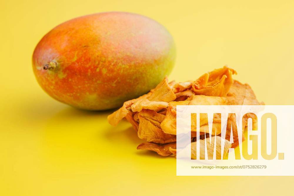 Dried mango fruit on yellow background., Dried mango fruit on the yellow background., Dried mango fruit on the yellow background., 13.12.2023,