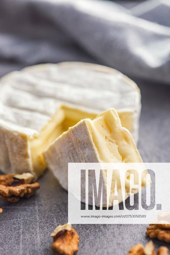 Brie type cheese with white mold. French camembert cheese on kitchen table., Brie type cheese with white mold. French camembert cheese on the kitchen table., Brie type cheese with white mold. French camembert cheese on the kitchen table., 05.01.2024,