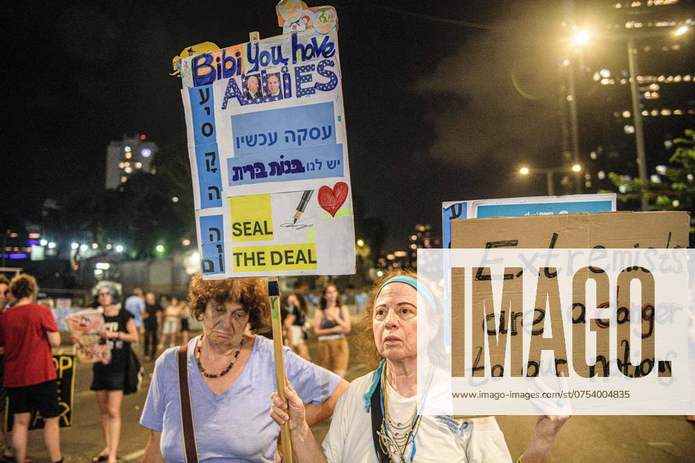 Israeli female protesters hold placards that say: Extremists are a danger to our nation and Bibi you have allies, Seal the Deal! during the rally. Thousands of Israelis demonstrated with the hostage s families against Prime Minister Benjamin Netanyahu, demanding an immediate hostage deal and ceasefire - as Israel awaits the Iranian and Hezbollah attack. Tel Aviv Israel - ZUMAs197 20240810_aaa_s197_759