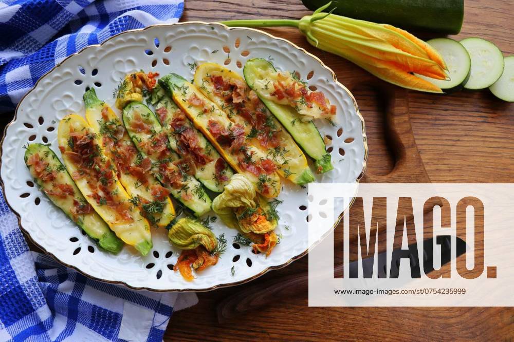Fried zucchini stuffed with minced meat, cheese and bacon on wooden background, Fried zucchini stuffed with minced meat, cheese and bacon on wooden background ., Fried zucchini stuffed with minced meat, cheese and bacon on wooden background ., 14.05.2024,