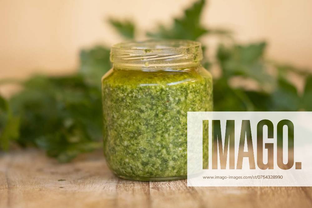 Homemade basil pesto, fresh homemade basil pesto in a glass jar, fresh homemade basil pesto in a glass jar, 23.05.2024,