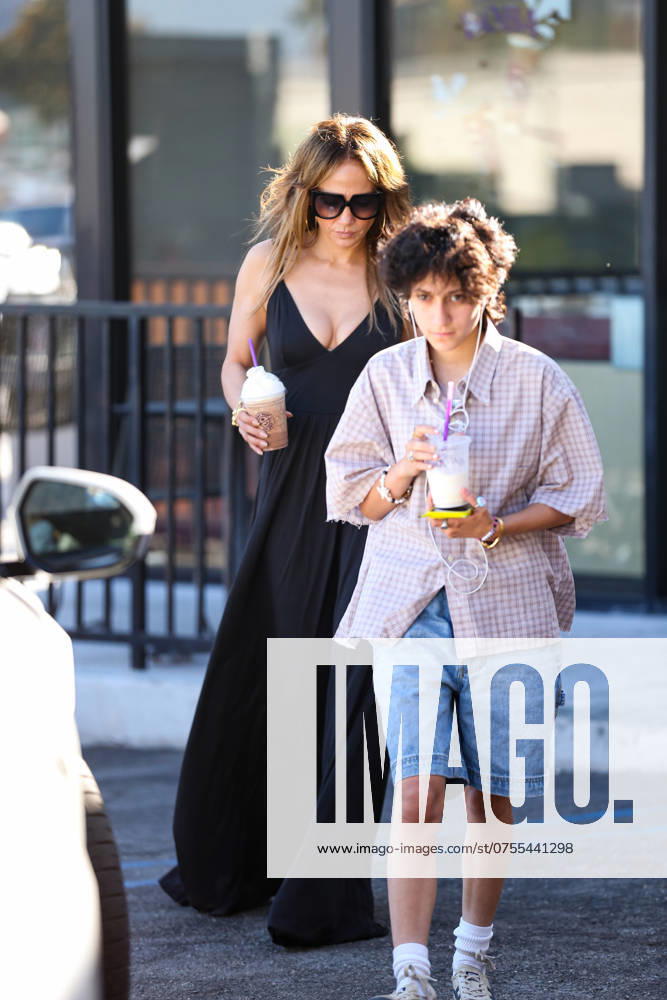 Jennifer Lopez donning a black sun dress seen with daughter Emme Muniz getting some frozen drinks while out in the city. Featuring: Jennifer Lopez, Emme Muniz Where: Los Angeles, California, United States When: 17 Aug 2024 Credit: BauerGriffin INSTARimages . NOT FOR USE BY NEWSPAPERS BASED IN THE UK.