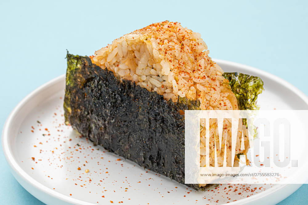 Portion of japanese onigiri snack with spices Portion of japanese onigiri snack with spices on a plate