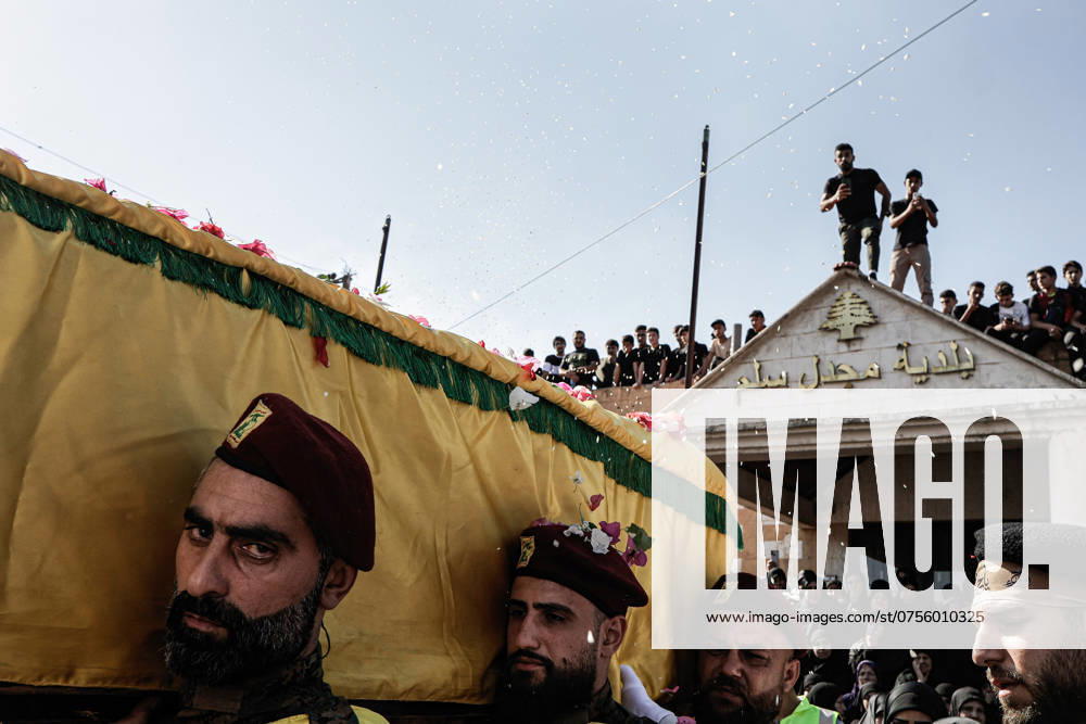 Funeral of a Hezbollah Fighter in Majdal Silim, Lebanon - 20 Aug 2024 Mourners carry the coffin of Hezbollah fighter Abbas Badii Milhim, born in 1990 with the call sign Jihad who was killed by the Israeli forces in southern Lebanon during his funeral ceremony. Majdal Slim Lebanon