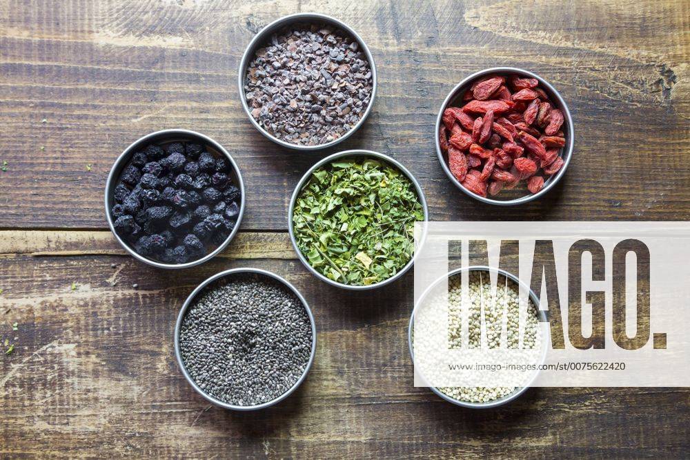 Bowls of chokeberries, chia, cocoa, quinoa, moringa and wolfberries SARF03104
