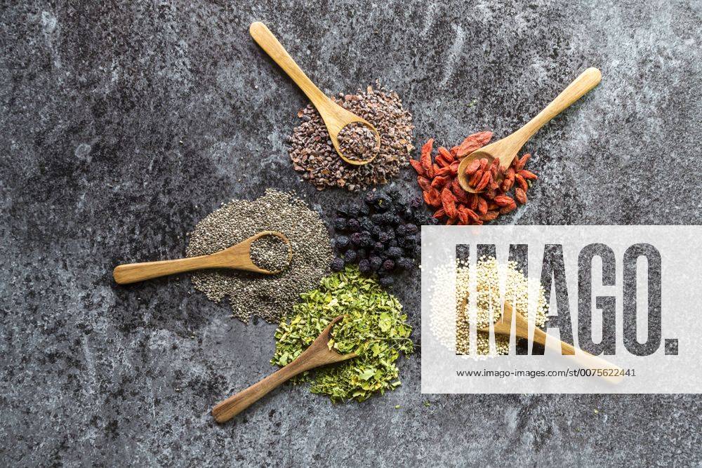 Wooden spoons of chokeberries, chia, aronia, quinoa, moringa and wolfberries SARF03109