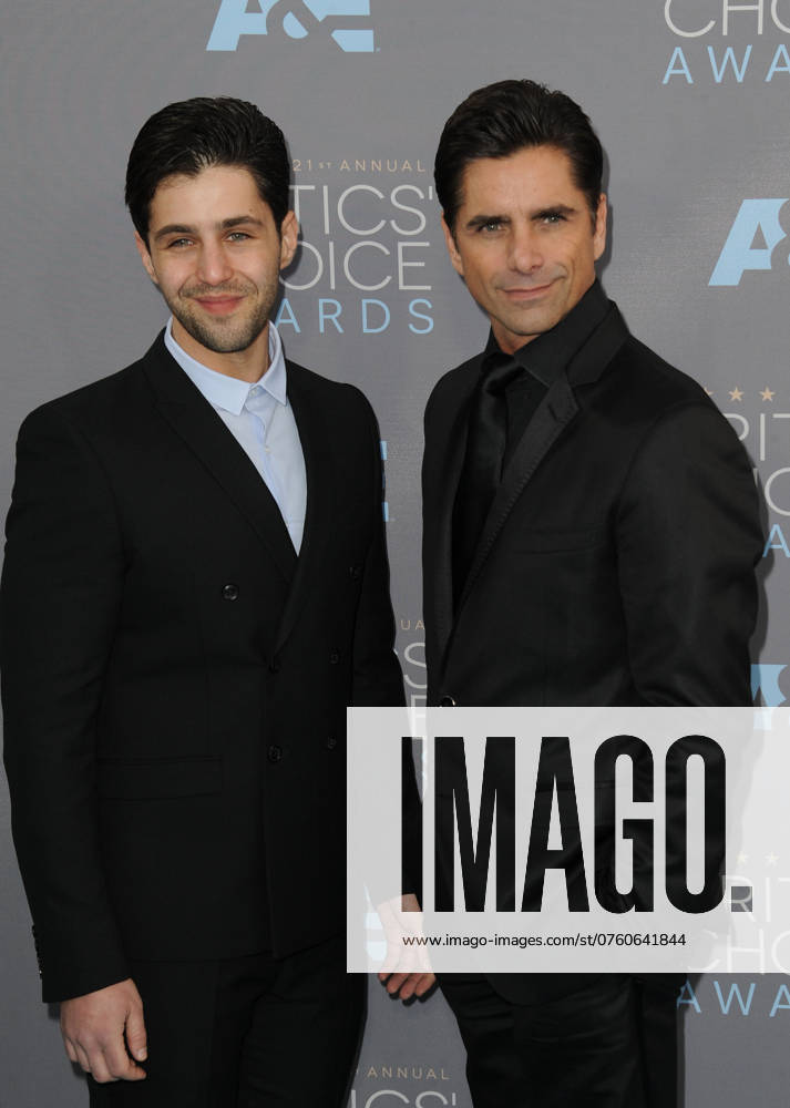 Actors Josh Peck (L) and John Stamos arriving at the 21st Annual Critics Choice Awards at Barker Hangar on January 17, 2016 in Santa Monica, California.