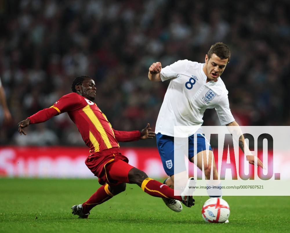 Jack Wilshere of England gets tackled by Anthony Annan of Ghana - Friendly England (white) v Ghana 29th March, 2011 .