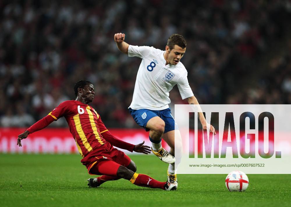 Jack Wilshere of England gets tackled by Anthony Annan of Ghana - Friendly England (white) v Ghana 29th March, 2011 .