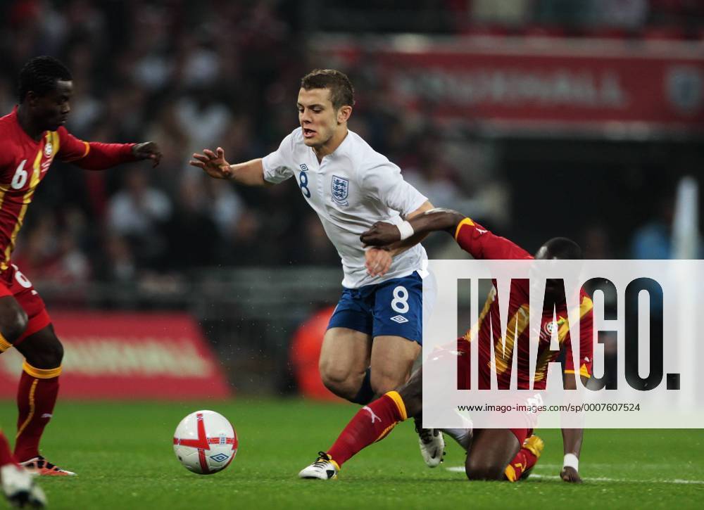 Jack Wilshere of England gets tackled by Emmanuel Agyemang-Badu of Ghana - Friendly England (white) v Ghana 29th March, 2011 .