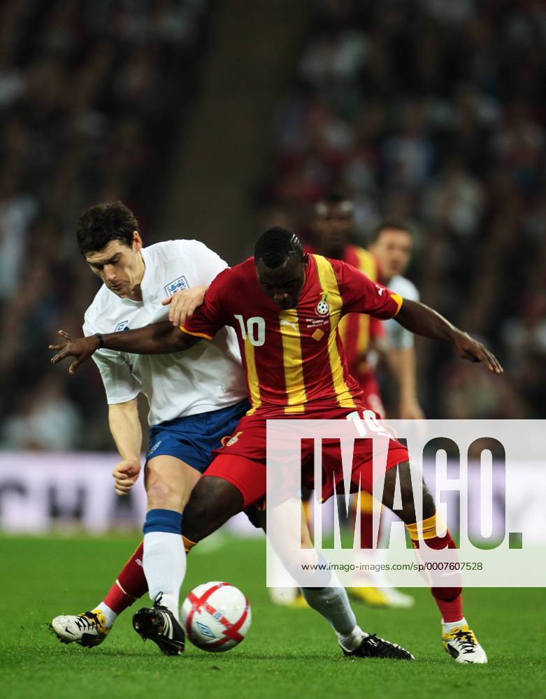 Gareth Barry of England tackles Kwadwo Asamoah of Ghana - Friendly England (white) v Ghana 29th March, 2011 .
