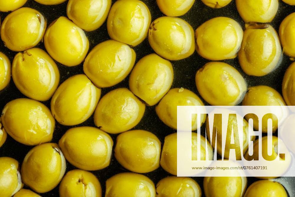 Sliced pickled green olives in brine., Sliced pickled green olives in a brine. Top view., Sliced pickled green olives in a brine. Top view., 07.08.2024,