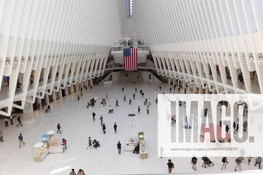 An American flag hangs inside the Oculus, a transportation hub and shopping center at the World Trade Center site. New York USA - ZUMAr174 20240910_znp_r174_001