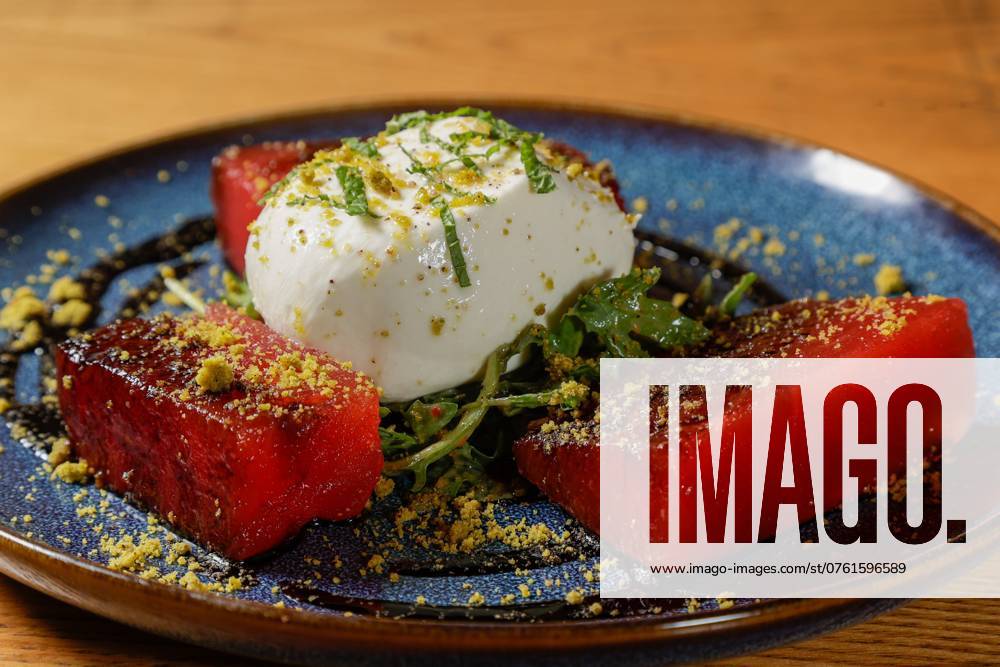 Burrata and Compressed Watermelon with.arugula, herb vinaigrette, roasted pistachios, balsamic reduction, and garlic oil is pictured at Brick and Mortar on Wednesday, Sept. 11, 2024 in St. Petersburg. St. Petersburg USA - ZUMAs70_ 20240911_zan_s70_024