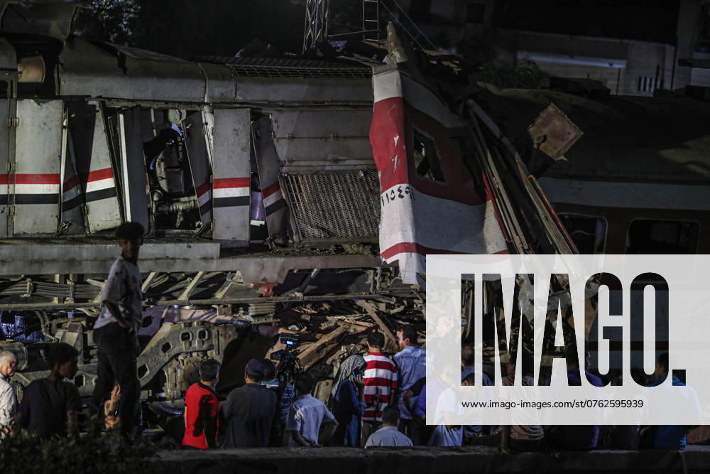 (240915) -- SHARQIYA, Sept. 15, 2024 -- People gather at the scene of a two-train collision accident in Sharqiya Province, Egypt, Sept. 14, 2024. At least three people were killed and 49 others injured on Saturday in a two-train collision in Sharqiya Province north of the Egyptian capital Cairo, according to Egypt s Ministry of Health. ) (SpotNews)EGYPT-SHARQIYA-TRAIN COLLISION AhmedxGomaa