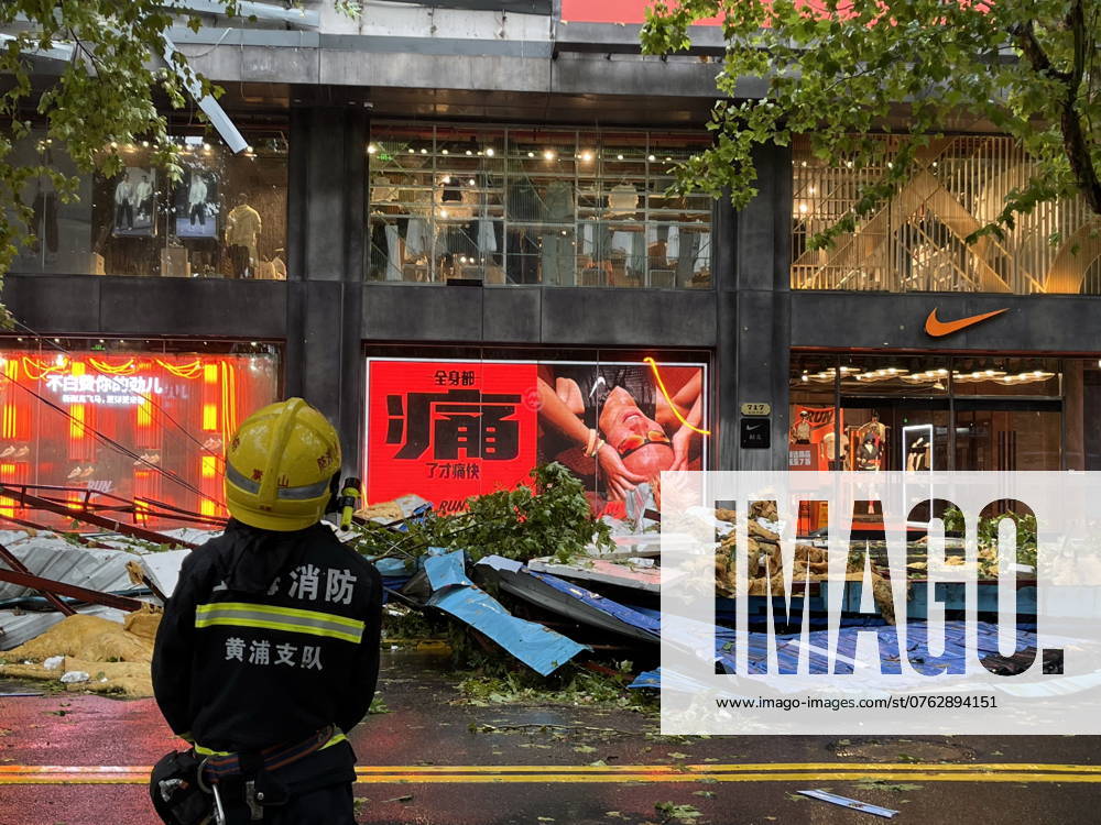 China Shanghai Typhoon Bebinca A fireman looks at the sidewalk damaged by the typhoon in Shanghai, China Monday, Sept. 16, 2024. Typhoon Bebinca, the most powerful typhoon to hit the metropolis in 75 years, has landed in Shanghai Monday morning. The big character in the advert reads Hurted ., Credit:FEATURECHINA Avalon CHINA, SHANGHAI