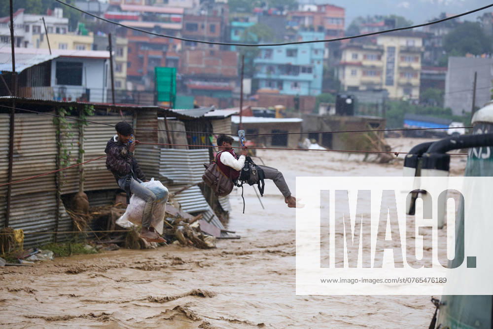 Monsoon Rain Creates Havoc In Nepal, At Least 32 Killed In Kathmandu Valley In 24 Hours Nepal s Armed Police Force rescues stranded people using a zipline rescue method from a flooded river in Lalitpur, Nepal, on September 28, 2024. At least 32 people die in Kathmandu Valley alone within 24 hours on September 28, 2024. Kathmandu Valley Nepal