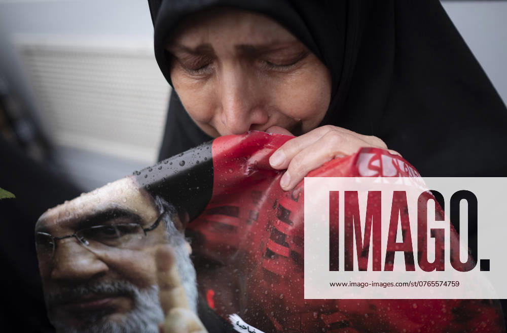 Iran Reaction Protest Against Killing of Hassan Nasrallah A veiled Iranian protester mourns while holding a portrait of Lebanon s Hezbollah Secretary General, Hassan Nasrallah, during a protest gathering to condemn an Israeli air strike against Hezbollah s headquarters in the suburb of Beirut, in Tehran, Iran, on September 28, 2024. Lebanon s Hezbollah Leader, Hassan Nasrallah, dies in a massive Israeli air strike against Hezbollah s headquarters on Friday evening, September 27, in the suburb of Beirut. Tehran Tehran Iran