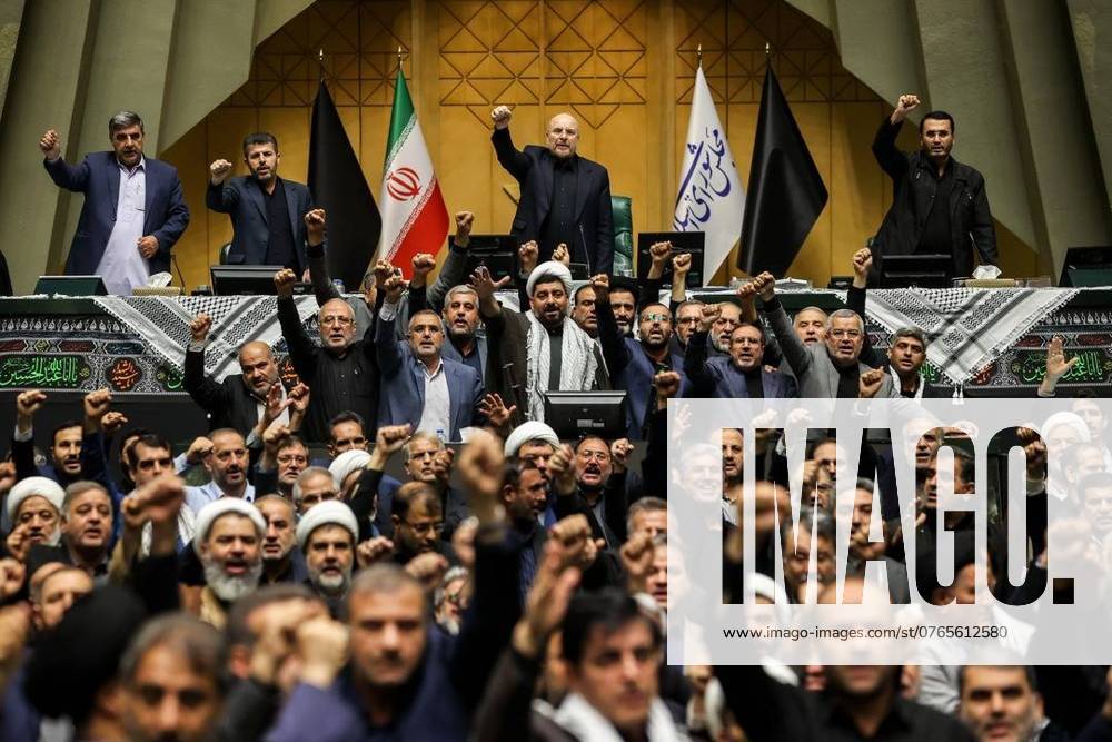 Iranian lawmakers chant anti-Isreal slogans during a closed session of the Iranian Parliament in Tehran. The Lebanese militant group Hezbollah confirmed that its leader, Hassan Nasrallah, was killed in an Israeli military strike on the group s central headquarters in Beirut on 27 September 2024. Iran condemned the Israeli strikes on Lebanon. Tehran Iran - ZUMAi98_ 20240929_zih_i98_010
