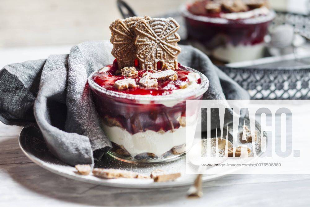 Glass of dessert of almond biscuits, Greek yoghurt and cranberry compote SBDF03122
