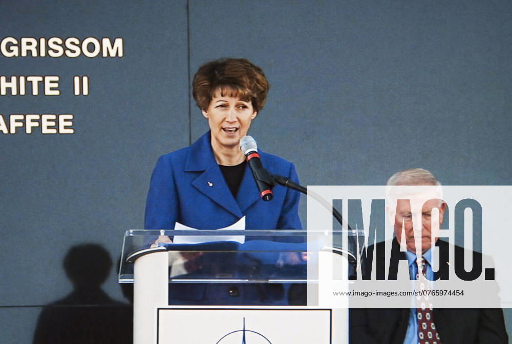 CAPE CANAVERAL, Fla. -- Former NASA astronaut Eileen Collins speaks during the Day of Remembrance ceremony. She commanded Discovery on the STS-114 mission that returned the shuttle program to flight following STS-107. Visible to the right is former NASA astronaut Jon McBride, chairman of the Astronauts Memorial Foundation board of directors. Space center employees and guests gathered at the Space Mirror Memorial at the spaceport s visitor complex for the annual event which took place on the 10th anniversary of the loss of the space shuttle Columbia and its crew. The ceremony also honored the astronauts of Apollo 1 and the shuttle Challenger. Dedicated in 1991, the names of fallen astronauts are emblazoned the Space Mirror Memorial s 4.5-foo