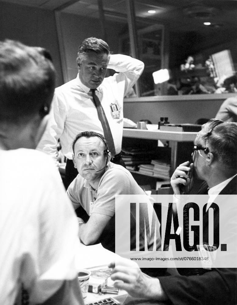 CAPE CANAVERAL, Fla. - Inside Mercury Mission Control, Walter C. Williams standing, associate director for Project Mercury operations, and Christopher Kraft seated, left, flight director, work in flight control as the decision is made to have Mercury astronaut Gordon Cooper aboard his spacecraft, Faith 7, go the full 22 orbits. The launch took place on May 15, 1963. The Mercury Mission Control Center in Florida played a key role in the United States early spaceflight program. Located at Cape Canaveral Air Force Station, the original part of the building was constructed between 1956 and 1958, with additions in 1959 and 1963. The facility officially was transferred to NASA on Dec. 26, 1963, and served as mission control during all the Projec