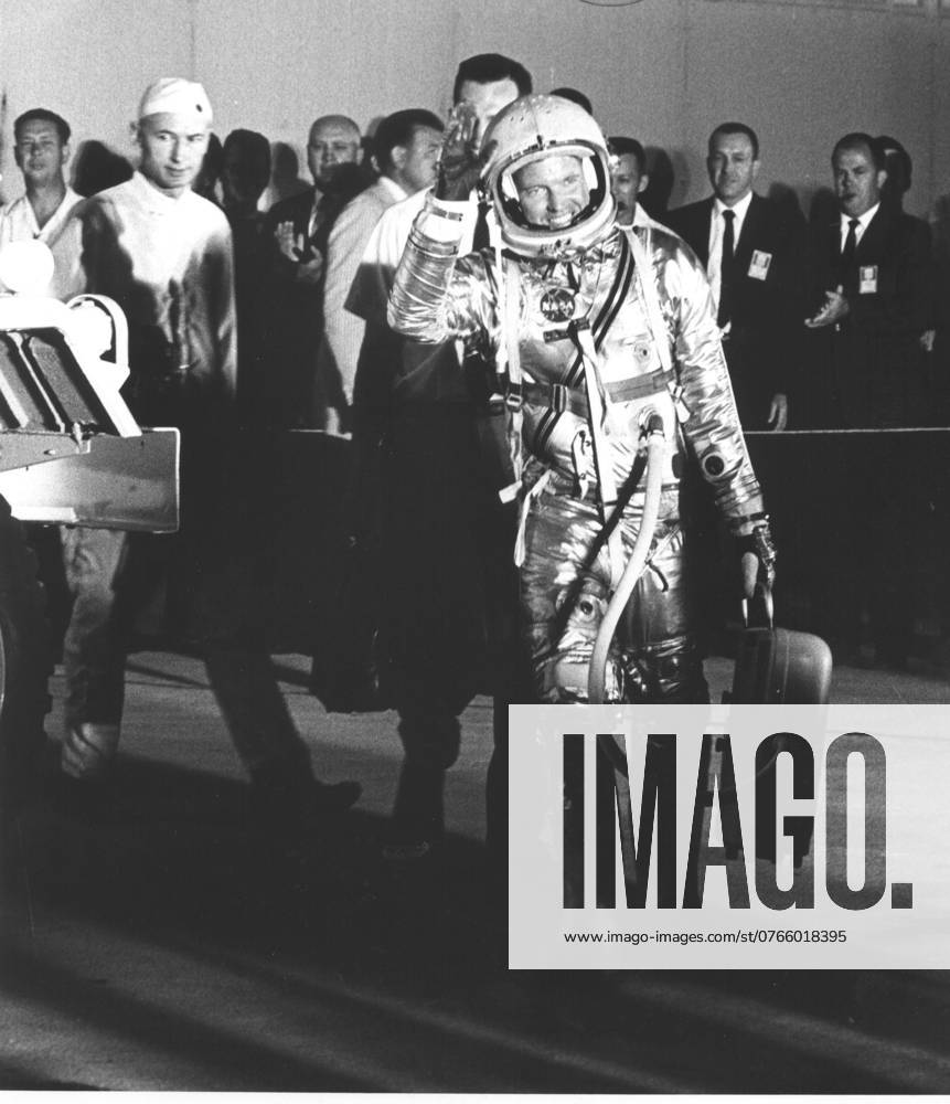 CAPE CANAVERAL, FLA. -- Hangar S -- Mercury workers and news media are greeted by astronaut L. Gordon Cooper as he leaves Hangar S for Pad 14 to start his 22-orbit mission, MA-9.