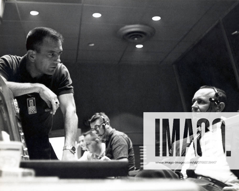 CAPE CANAVERAL, Fla. - Inside Mercury Mission Control, astronaut Deke Slayton left discusses a point with Christopher Kraft, Mercury s flight director, during preparations for astronaut Gordon Cooper s Faith 7 launch, which took place on May 15, 1963. The Mercury Mission Control Center in Florida played a key role in the United States early spaceflight program. Located at Cape Canaveral Air Force Station, the original part of the building was constructed between 1956 and 1958, with additions in 1959 and 1963. The facility officially was transferred to NASA on Dec. 26, 1963, and served as mission control during all the Project Mercury missions, as well as the first three flights of the Gemini Program, when it was renamed Mission Control Cen