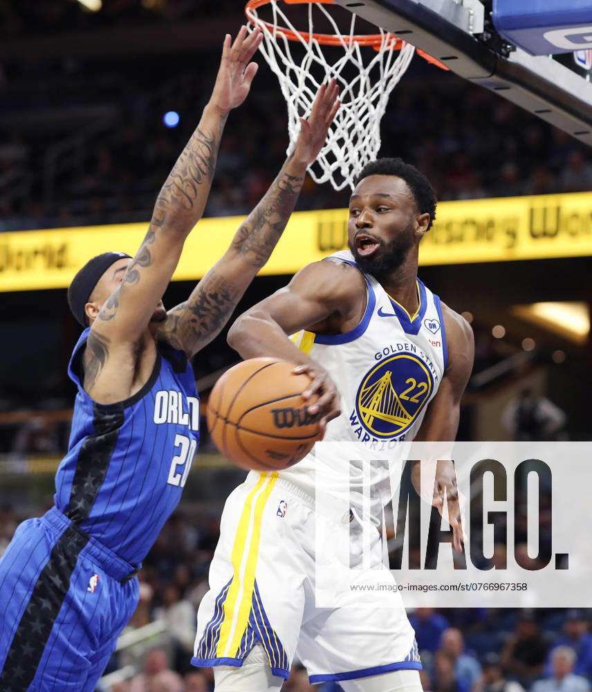 Orlando, FL - Florida, USA: The Golden State Warriors Andrew Wiggins, right, passes around the Orlando Magic s Markelle Fultz at the Kia Center on Wednesday, March 27, 2024, in Orlando, Florida. Orlando USA - ZUMAm67_ 20240327_zaf_m67_073