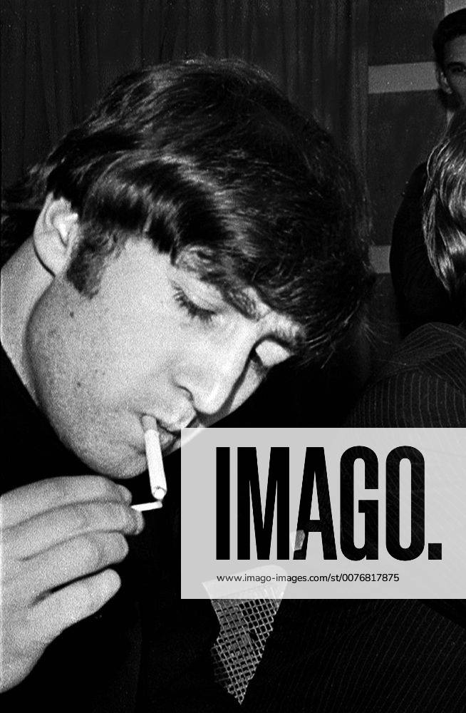 John Winston Ono Lennon, MBE, born October 9, 1940, murdered December 8, 1980, was an English songwriter, singer, musician, graphic artist, author and peace activist who gained worldwide fame as one of the founders of The Beatles. PICTURED: Feb 13, 1964 - Miami, Florida, U.S. - JOHN LENNON lights up a cigarette during a press conference at the Deauville Hotel. The Beatles were here for the secound Ed Sullivan Show , the first in New York. The Beatles stayed a week and basked in the Florida sun. - ZUMAp42_ 20051208_sim_p42_427