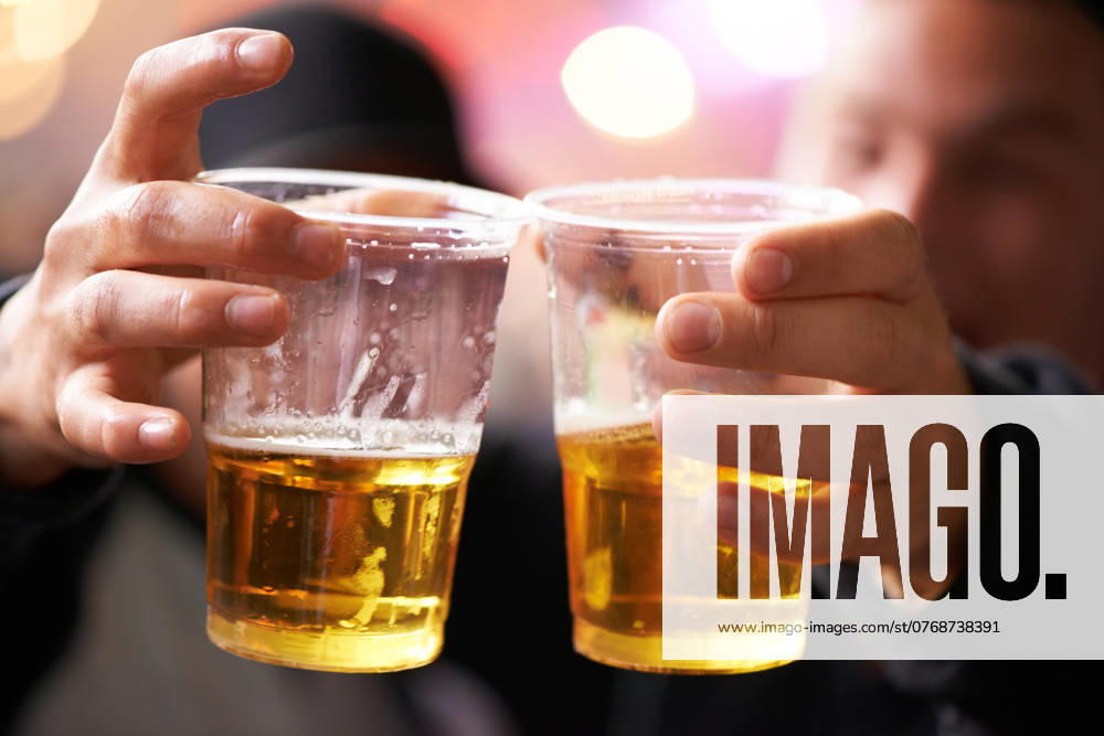 Hands of friends at music festival with cheers, beer and excited at concert event together. Drink, celebration and men at carnival party with freedom, adventure and people with plastic cup toast model released property released