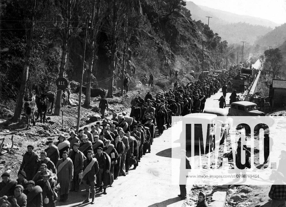Orig. caption... INTERNATIONAL BRIGADE CROSSES INTO FRANCE. 3,000 men of the International Brigade consisting of Poles, Germans and Czechs who have been fighting in Catalonia, marching across the mountain road to the border town of Le Perthus. Lorries loaded with retreating troops of the Government block the roads. Note Spanish Civil War - armed conflict between right-wing and left-wing forces in Spain 1936-39. The war began with a revolt against the incumbent Popular Front government. The right-wing forces (rebels), the Falange, with its leader General Franco, were supported by Italy and Germany. The government was supported by the left and volunteers from abroad in the International Brigade. Image archive catalog no. 50.10 sites: FRANCE;
